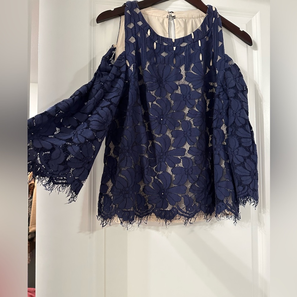 Exposed shoulder, high neck lace top